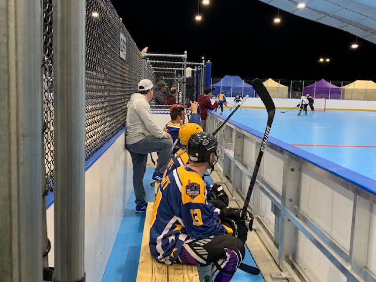 Players watching a night game from the bench